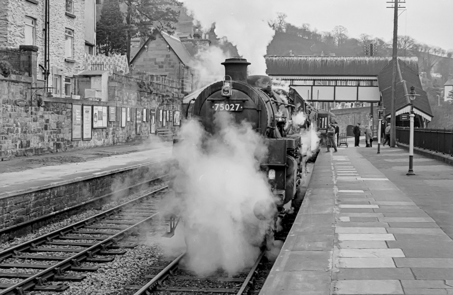 Llangollen station circa 1963 with a steam engine at the platform