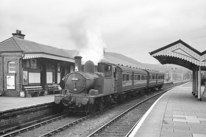 a steam train at a train station